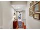 Hallway with hardwood floors and a collage of pictures at 328 Millridge Dr, Indianapolis, IN 46290
