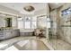 This elegant bathroom features a double vanity, modern fixtures, a soaking tub, and a glass shower at 328 Millridge Dr, Indianapolis, IN 46290
