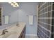 Double sinks and a shower/tub combination in a full bathroom that is clean and well maintained at 3341 Suffolk Ct, Greenwood, IN 46143