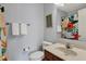 Cozy bathroom with floral shower curtain, light-colored walls, and traditional fixtures at 3341 Suffolk Ct, Greenwood, IN 46143