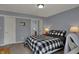 Charming bedroom featuring a checkered bed set, neutral walls and access to an ensuite bathroom at 3341 Suffolk Ct, Greenwood, IN 46143