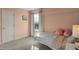 bedroom with pastel walls, rainbow decals, and a charming canopy bed for children at 3341 Suffolk Ct, Greenwood, IN 46143