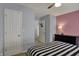 Comfortable bedroom features a dresser and a doorway leading to another room at 3341 Suffolk Ct, Greenwood, IN 46143