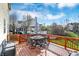 Relax on this wood deck with wrought iron table and chairs, and blue skies at 3341 Suffolk Ct, Greenwood, IN 46143