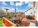 Charming deck with outdoor dining furniture, a barbecue grill, a patio heater and a blue striped umbrella at 3341 Suffolk Ct, Greenwood, IN 46143