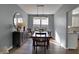 A formal dining room with wood floors, table and chairs, and a decorative mirror at 3341 Suffolk Ct, Greenwood, IN 46143