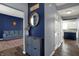 Inviting entryway featuring hardwood floors, stylish decor, and a view into a comfortable living space at 3341 Suffolk Ct, Greenwood, IN 46143