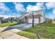 Well-maintained home featuring a spacious driveway and a basketball hoop on a green lawn at 3341 Suffolk Ct, Greenwood, IN 46143