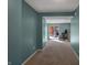 View of hallway leading to a bright living area with a glass sliding door at 3341 Suffolk Ct, Greenwood, IN 46143