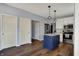 A lovely kitchen with a center island, white cabinets and pendant lighting at 3341 Suffolk Ct, Greenwood, IN 46143