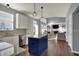 Open concept kitchen with a center island looking into the living room with fireplace at 3341 Suffolk Ct, Greenwood, IN 46143