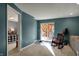 Cozy living area with a sliding glass door, rocking chair, and doorway to a bedroom at 3341 Suffolk Ct, Greenwood, IN 46143
