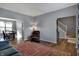 Open-concept living room featuring hardwood floors, a comfortable recliner, and easy access to the dining area at 3341 Suffolk Ct, Greenwood, IN 46143