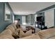 Spacious living room features a TV, a large couch, and a ceiling fan at 3341 Suffolk Ct, Greenwood, IN 46143