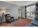 Cozy living room with hardwood floors, stylish curtains, and a comfortable leather recliner by the window at 3341 Suffolk Ct, Greenwood, IN 46143