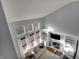 Aerial view of the living room with a fireplace, built-in shelving, and ample natural light at 3341 Suffolk Ct, Greenwood, IN 46143