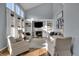 A bright living room with high ceilings, a fireplace, and built-in bookshelves at 3341 Suffolk Ct, Greenwood, IN 46143