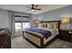 Bright main bedroom with neutral tones, a ceiling fan, and a comfortable bed with ample pillows at 3341 Suffolk Ct, Greenwood, IN 46143