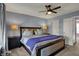 Cozy bedroom with a ceiling fan, soft lighting, and a comfortable bed with neutral décor at 3341 Suffolk Ct, Greenwood, IN 46143
