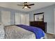 Comfortable bedroom with a large bed, wooden dresser, and ample closet space at 3341 Suffolk Ct, Greenwood, IN 46143