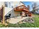 A backyard patio with a view of the upper deck, outdoor seating area, and lawn at 3341 Suffolk Ct, Greenwood, IN 46143