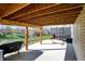 Covered patio area with outdoor lighting, hammock, grill, and direct access to backyard at 3341 Suffolk Ct, Greenwood, IN 46143