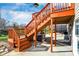 The patio showcases steps leading to an upper deck, grill, and backyard access at 3341 Suffolk Ct, Greenwood, IN 46143