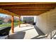 Covered patio area features outdoor lighting, a hammock, backyard access, and a grill at 3341 Suffolk Ct, Greenwood, IN 46143