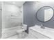 Bathroom featuring tub and shower, single sink vanity, and modern finishes at 337 E Minnesota St, Indianapolis, IN 46225