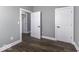 Bedroom featuring hardwood floors and multiple doors, great for closet and bathroom access at 337 E Minnesota St, Indianapolis, IN 46225