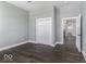Bedroom showcasing hardwood floors, a double-door closet, and an open doorway at 337 E Minnesota St, Indianapolis, IN 46225