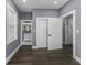 Bedroom with an open closet and adjoining bathroom featuring a modern vanity at 337 E Minnesota St, Indianapolis, IN 46225