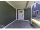 Covered porch features sleek white trim, new siding, and updated front door at 337 E Minnesota St, Indianapolis, IN 46225