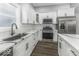 Modern kitchen featuring stainless steel appliances, custom cabinetry, and quartz countertops at 337 E Minnesota St, Indianapolis, IN 46225