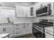 Stylish kitchen features stainless appliances, quartz countertops, and custom cabinetry at 337 E Minnesota St, Indianapolis, IN 46225