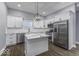 Modern kitchen with stainless steel appliances, a center island, and custom cabinetry at 337 E Minnesota St, Indianapolis, IN 46225