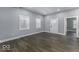 Spacious living room with laminate wood floors, gray walls, and modern trim at 337 E Minnesota St, Indianapolis, IN 46225