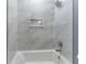 Bright and clean shower and tub featuring a large tiled surround and shower niche at 337 E Minnesota St, Indianapolis, IN 46225