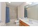 Bathroom with a single sink vanity, a bath tub and shower, and neutral walls at 350 N Meridian St # 205, Indianapolis, IN 46204