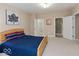 Bedroom with neutral walls and carpet and open access to walk-in closet and bathroom at 350 N Meridian St # 205, Indianapolis, IN 46204