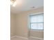 Bedroom featuring neutral walls, carpet, and a window with blinds at 350 N Meridian St # 205, Indianapolis, IN 46204