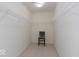 Walk-in closet with carpet, white walls and metal shelving with a chair at 350 N Meridian St # 205, Indianapolis, IN 46204