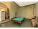 Inviting game room featuring a well-maintained billiard table, seating, and unique architectural details at 350 N Meridian St # 205, Indianapolis, IN 46204