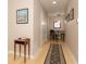 Inviting hallway with wood floors, neutral paint, table decor and an adjacent dining area at 350 N Meridian St # 205, Indianapolis, IN 46204