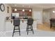 Well-appointed kitchen with granite countertops, stainless steel appliances, and seating at the breakfast bar at 350 N Meridian St # 205, Indianapolis, IN 46204