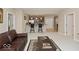 Open-concept living space with breakfast bar, sofa and a view to the kitchen at 350 N Meridian St # 205, Indianapolis, IN 46204