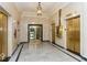 Elegant lobby featuring marble floors, gold elevators, and classic lighting at 350 N Meridian St # 205, Indianapolis, IN 46204