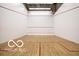 Bright racquetball court featuring clean white walls and hardwood floors marked with red lines at 350 N Meridian St # 205, Indianapolis, IN 46204