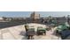 A cozy rooftop patio features comfortable seating and panoramic cityscape views at 350 N Meridian St # 205, Indianapolis, IN 46204