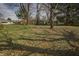 Large backyard featuring a shed and plenty of green space at 3510 Chamberlin Dr, Indianapolis, IN 46237